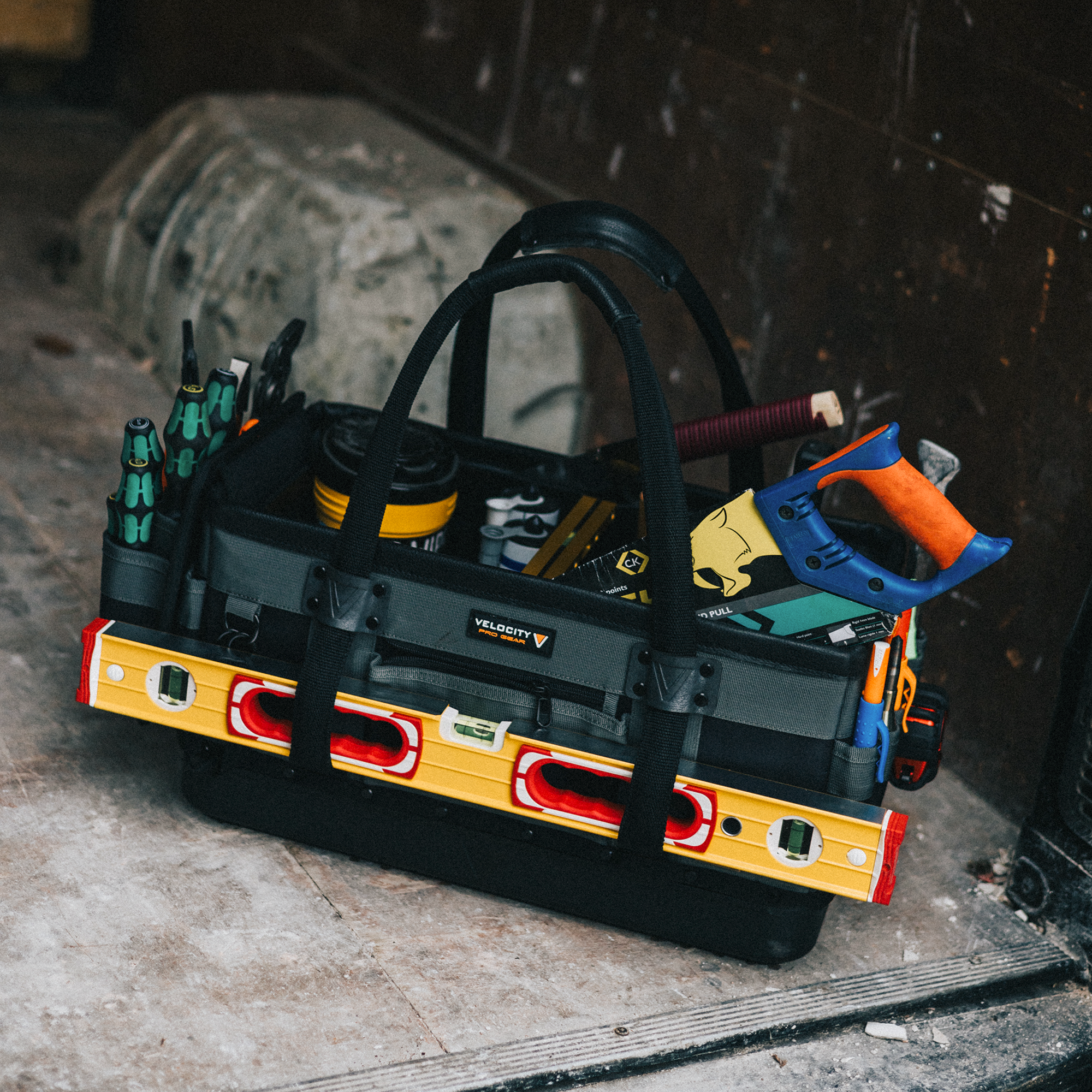 Rogue 11.0 Contractors tool bag loaded with tools like wera and a stabila level, in the back of a van